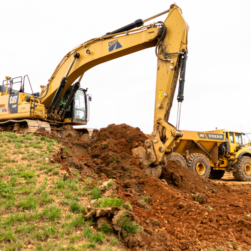 Excavator pulling sand